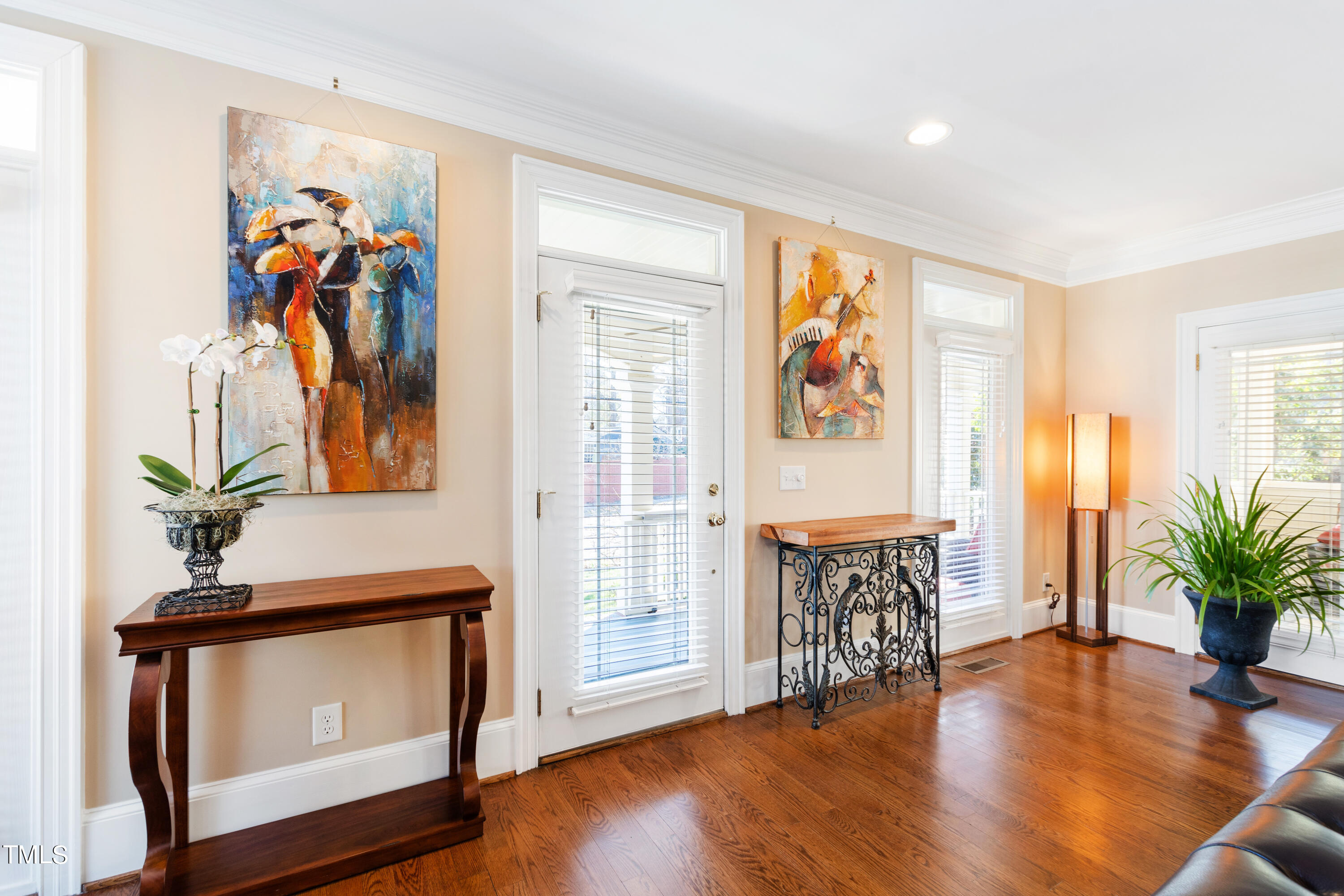 229 Woodburn Road Raleigh, NC 27605 - Photo 5 of 64 a living room with furniture and a potted plant