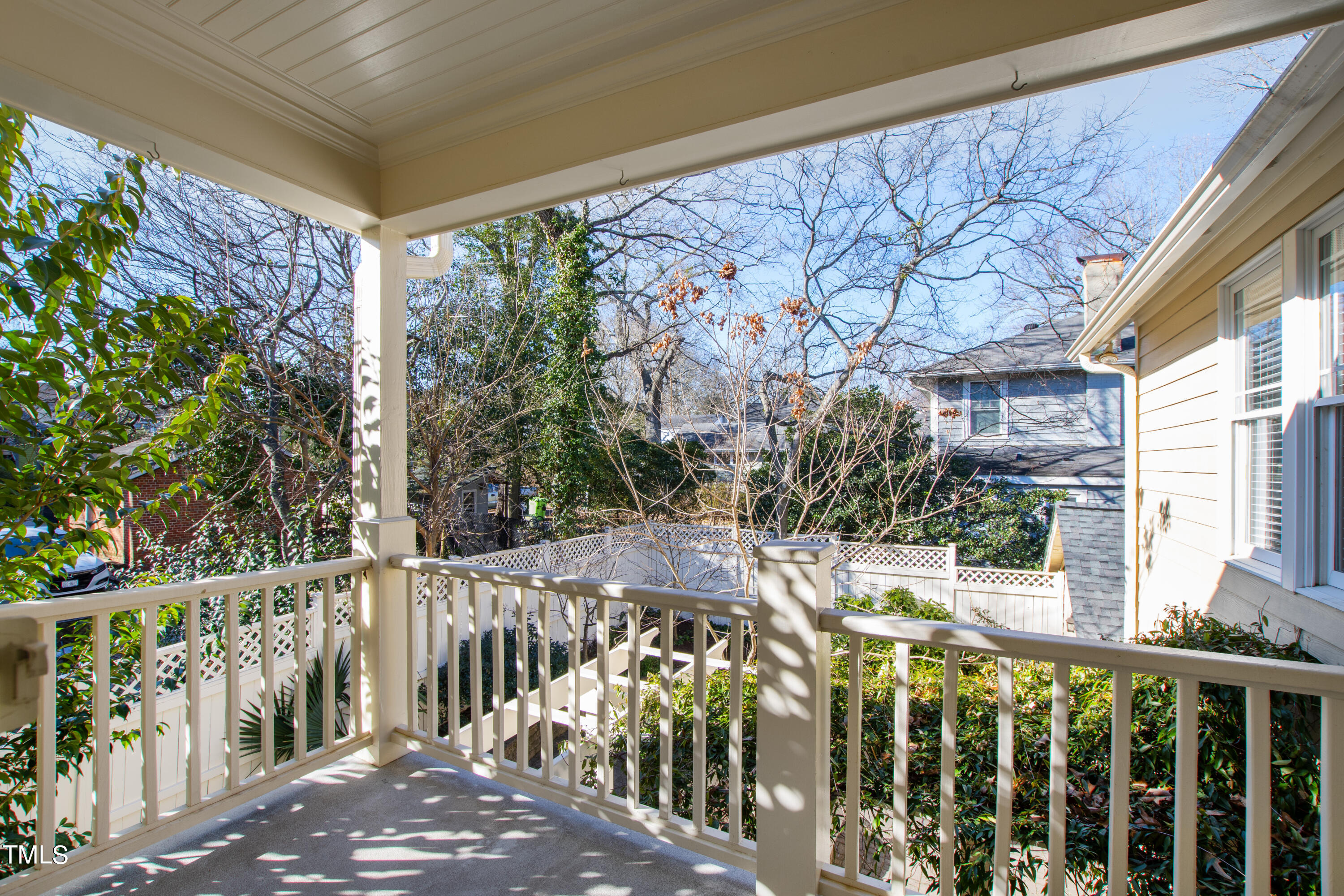 229 Woodburn Road Raleigh, NC 27605 - Photo 51 of 64 a view of a house with a small yard and wooden fence