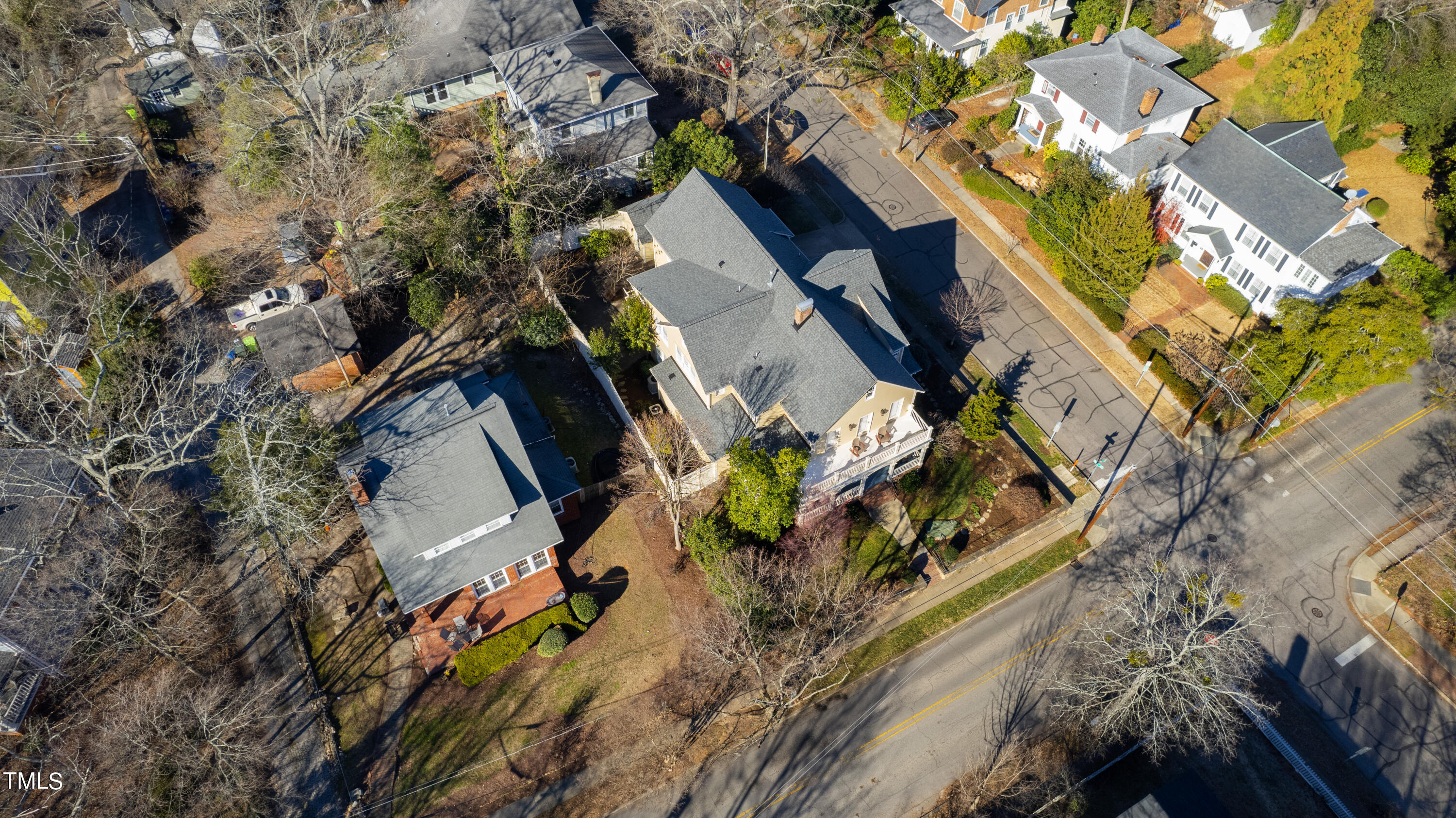 229 Woodburn Road Raleigh, NC 27605 - Photo 62 of 64 an aerial view of a house with a yard and wooden fence
