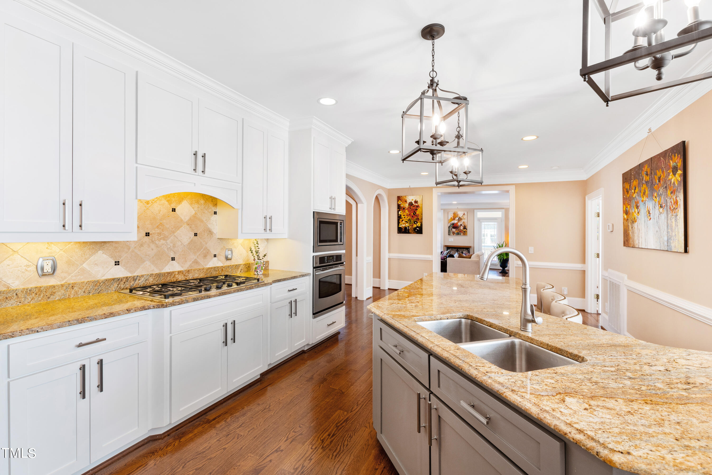 229 Woodburn Road Raleigh, NC 27605 - Photo 8 of 64 a kitchen with granite countertop a sink a counter space appliances and cabinets