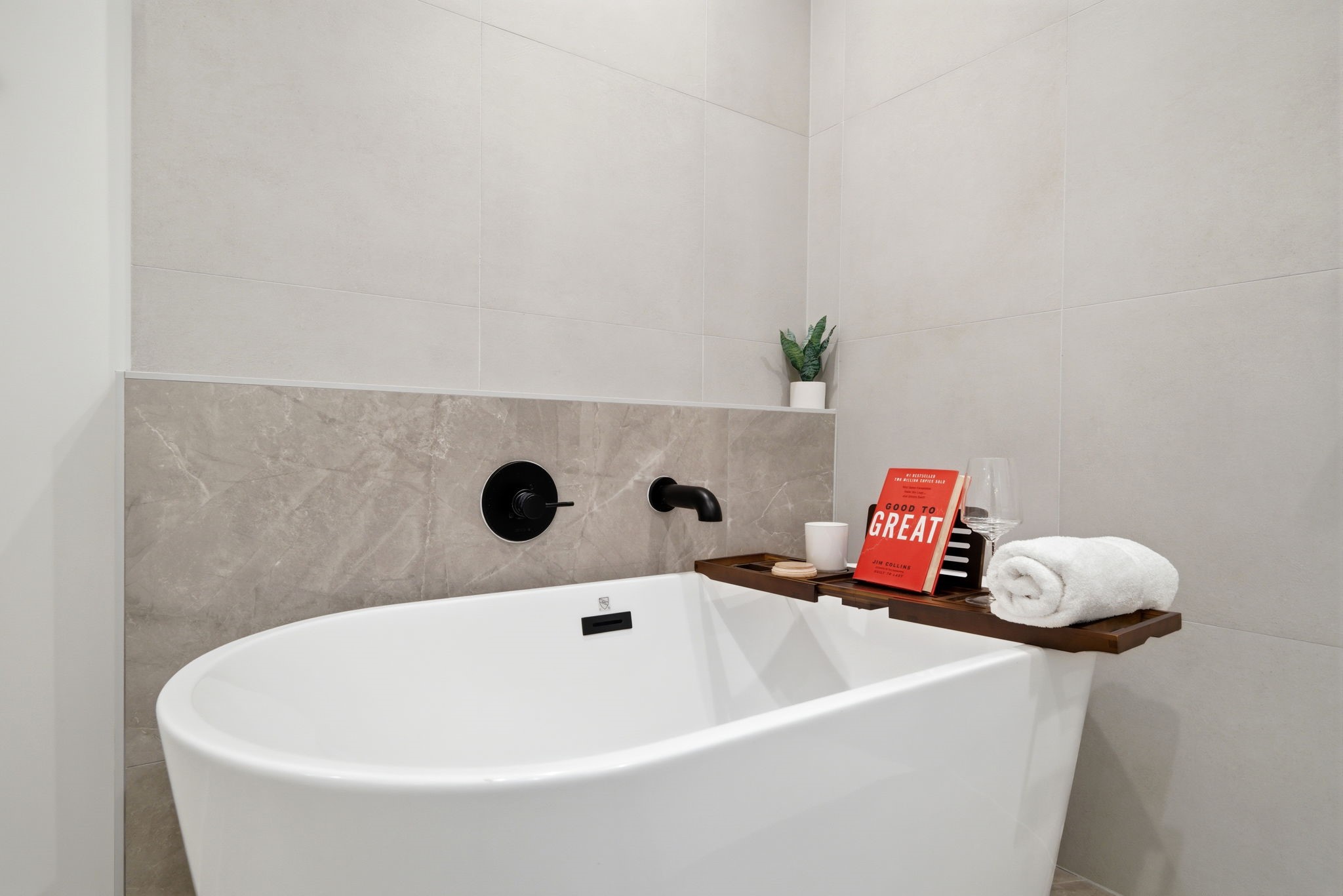 1607 Barbee Street Houston, TX 77004 - Photo 17 of 27 Experience ultimate relaxation in this stunning luxury spa-inspired bathroom, featuring a spacious central freestanding bathtub as its centerpiece.