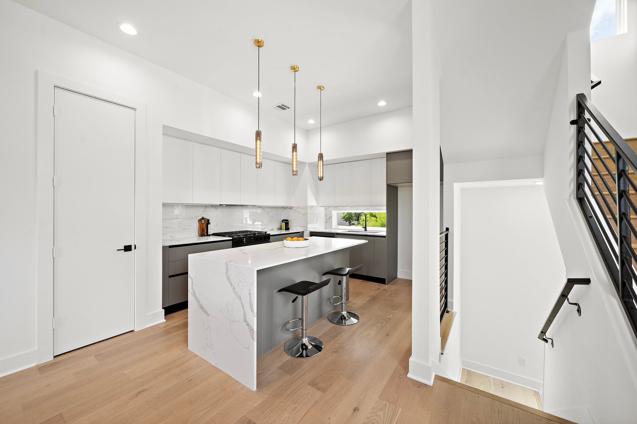 1607 Barbee Street Houston, TX 77004 - Photo 5 of 27 Gourmet kitchen with sleek cabinetry, spacious countertops, and premium appliances, enhanced by elegant under-cabinet lighting that highlights every detail.
