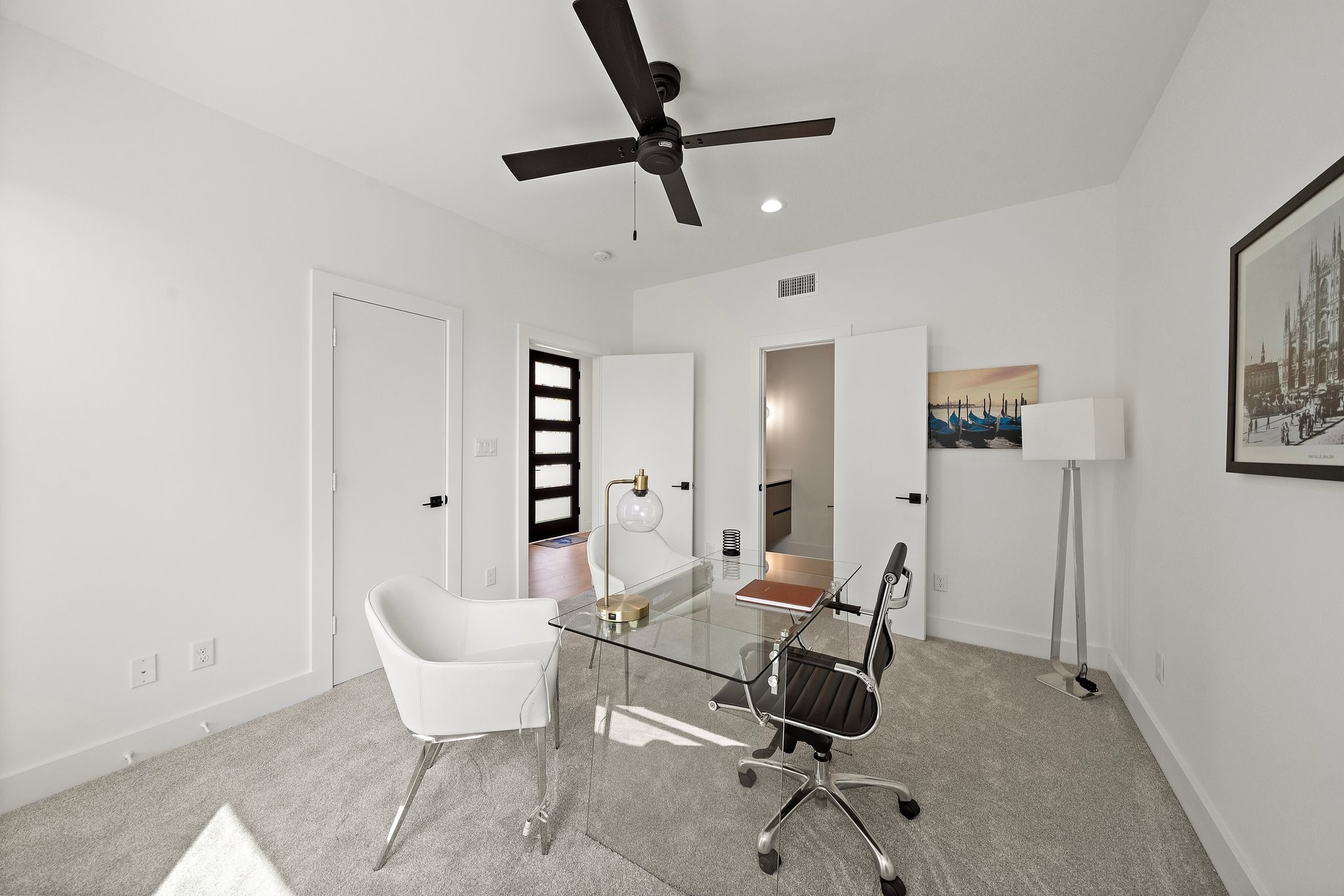 1607 Barbee Street Houston, TX 77004 - Photo 7 of 27 This versatile room downstairs offers endless possibilities, perfect for use as a home office, playroom, or additional bedroom. With plenty of natural light and a flexible layout, it can easily adapt to suit your needs.