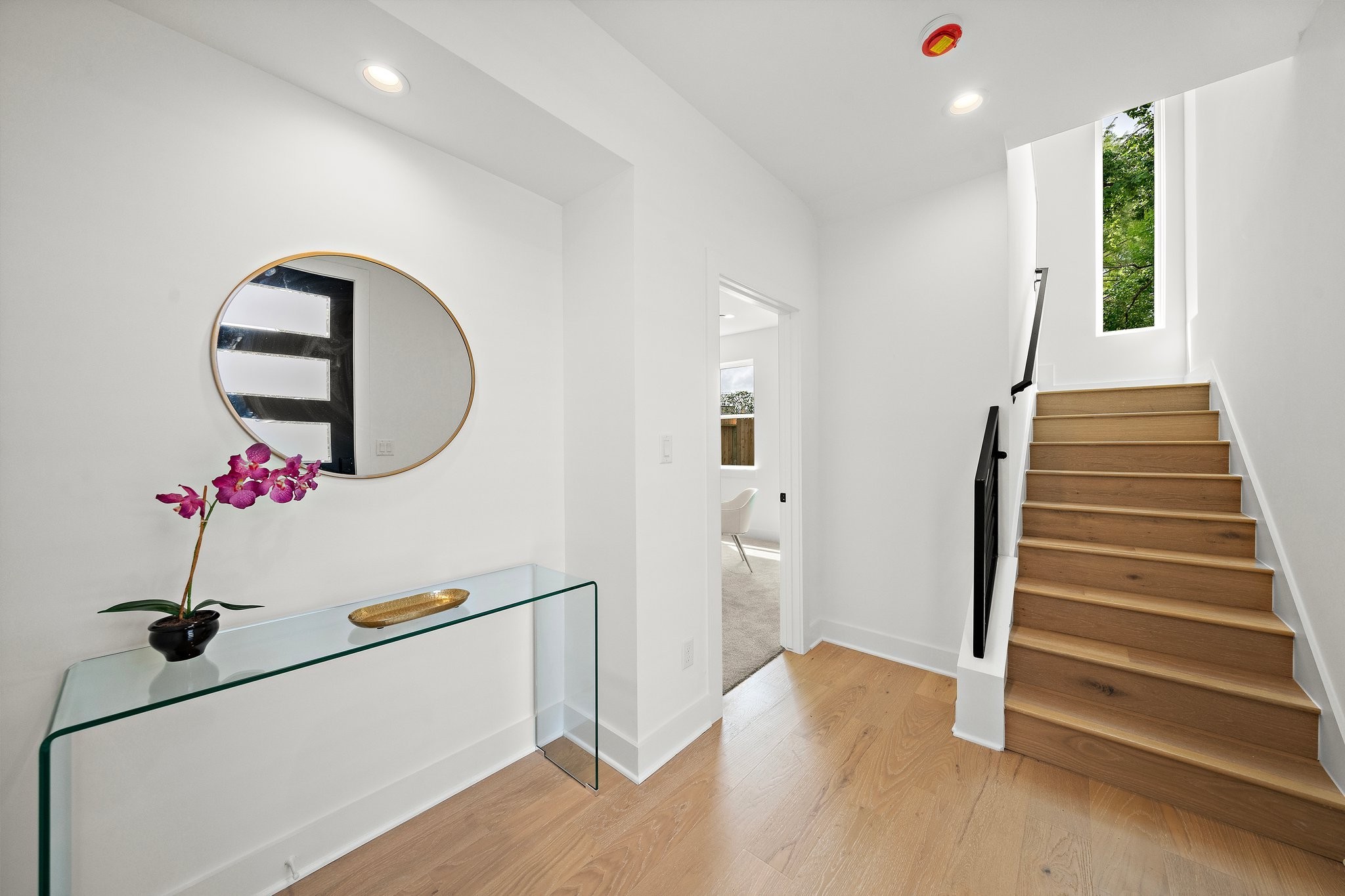 1607 Barbee Street Houston, TX 77004 - Photo 9 of 27 Step into a welcoming entryway that sets the tone for the rest of the home with its clean lines, abundant natural light, and inviting atmosphere. The space features a modern front door, tasteful flooring, and a seamless flow into the house—offering a perfect first impression