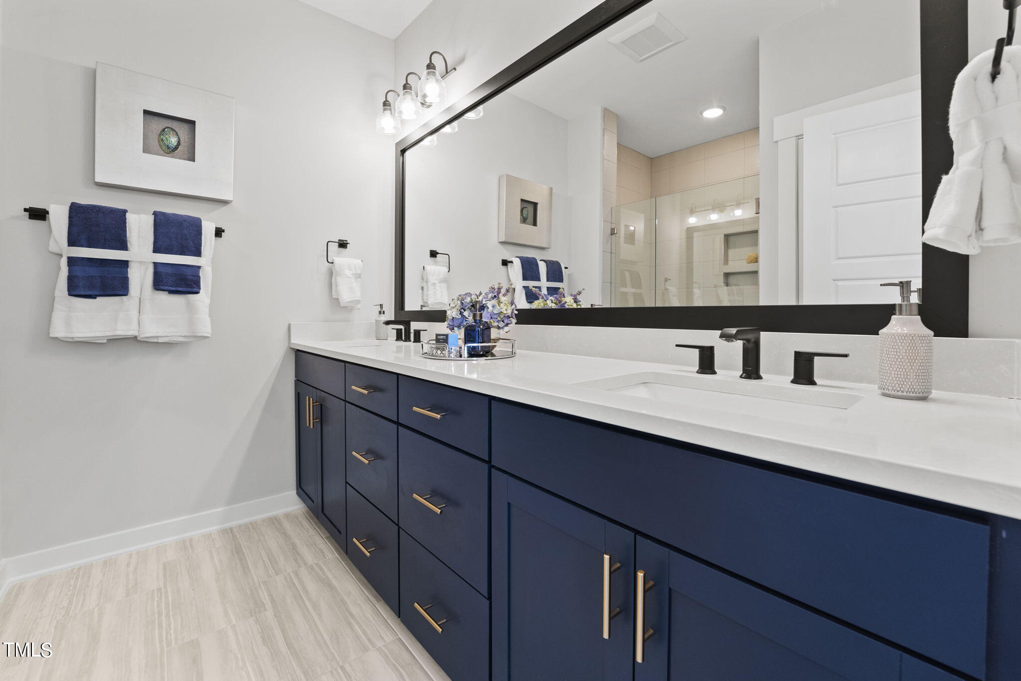 2130 Mars Hill Lane Apex, NC 27502 - Photo 13 of 21 a bathroom with a double vanity sink and a mirror