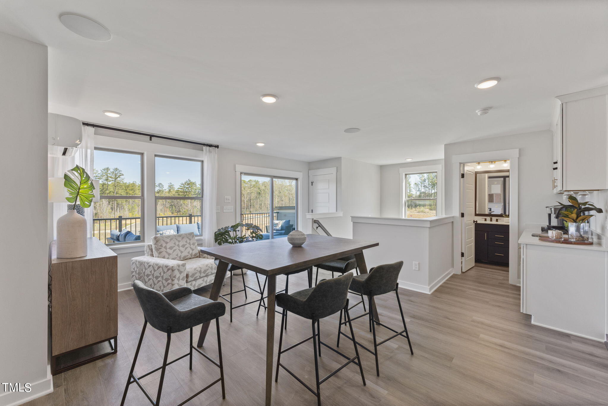 2130 Mars Hill Lane Apex, NC 27502 - Photo 17 of 21 a view of a dining room with furniture and wooden floor