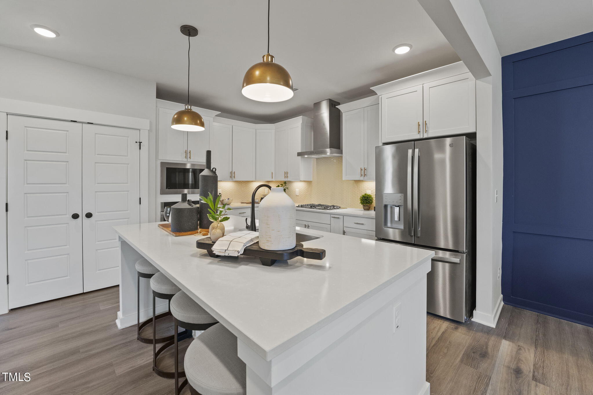 2130 Mars Hill Lane Apex, NC 27502 - Photo 4 of 21 a kitchen with refrigerator and wooden floor