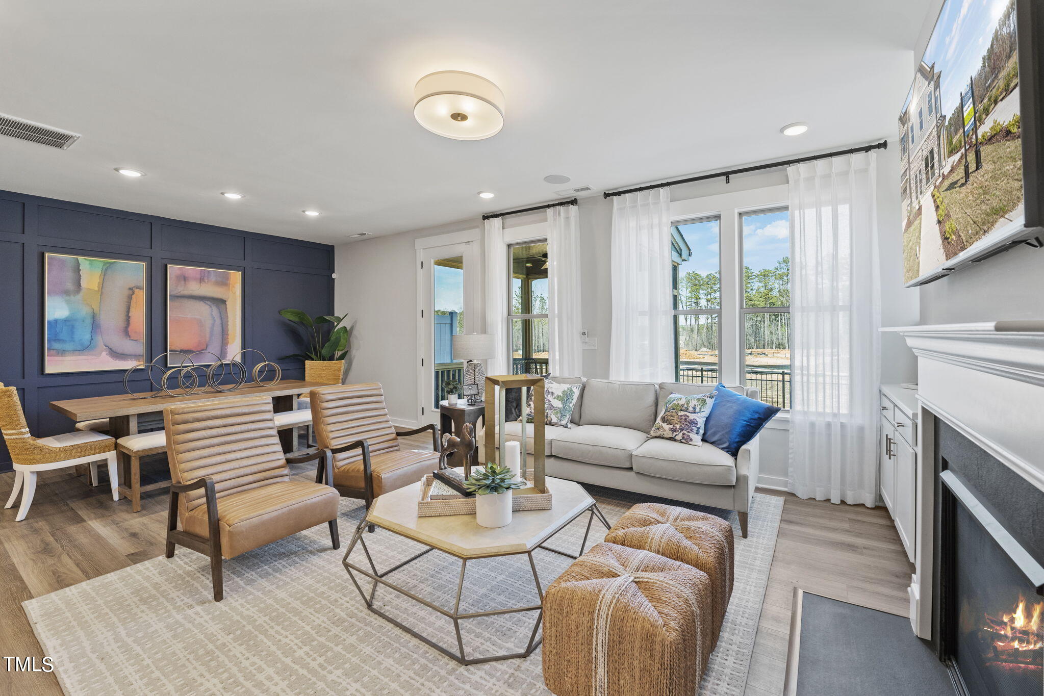 2130 Mars Hill Lane Apex, NC 27502 - Photo 5 of 21 a living room with furniture fireplace and a large window