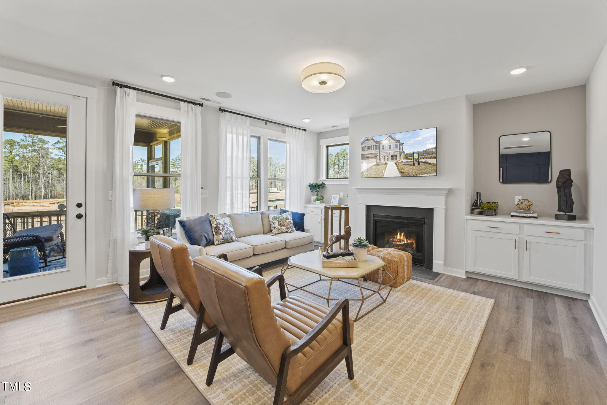 2130 Mars Hill Lane Apex, NC 27502 - Photo 7 of 21 a living room with furniture and a fireplace