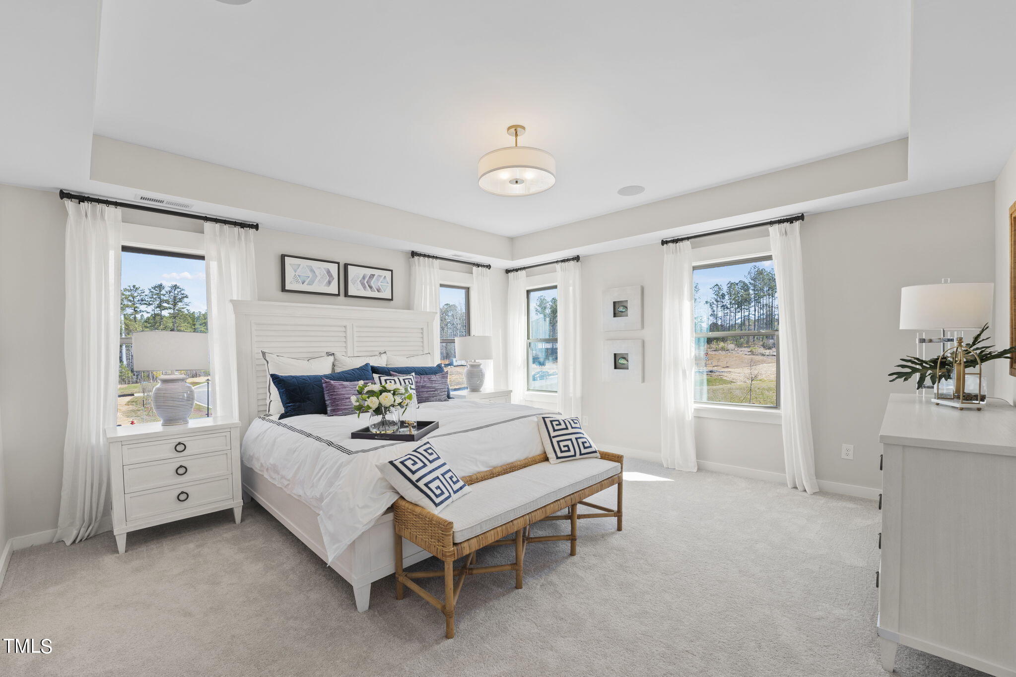 2130 Mars Hill Lane Apex, NC 27502 - Photo 10 of 21 a bedroom with a bed and a table in it