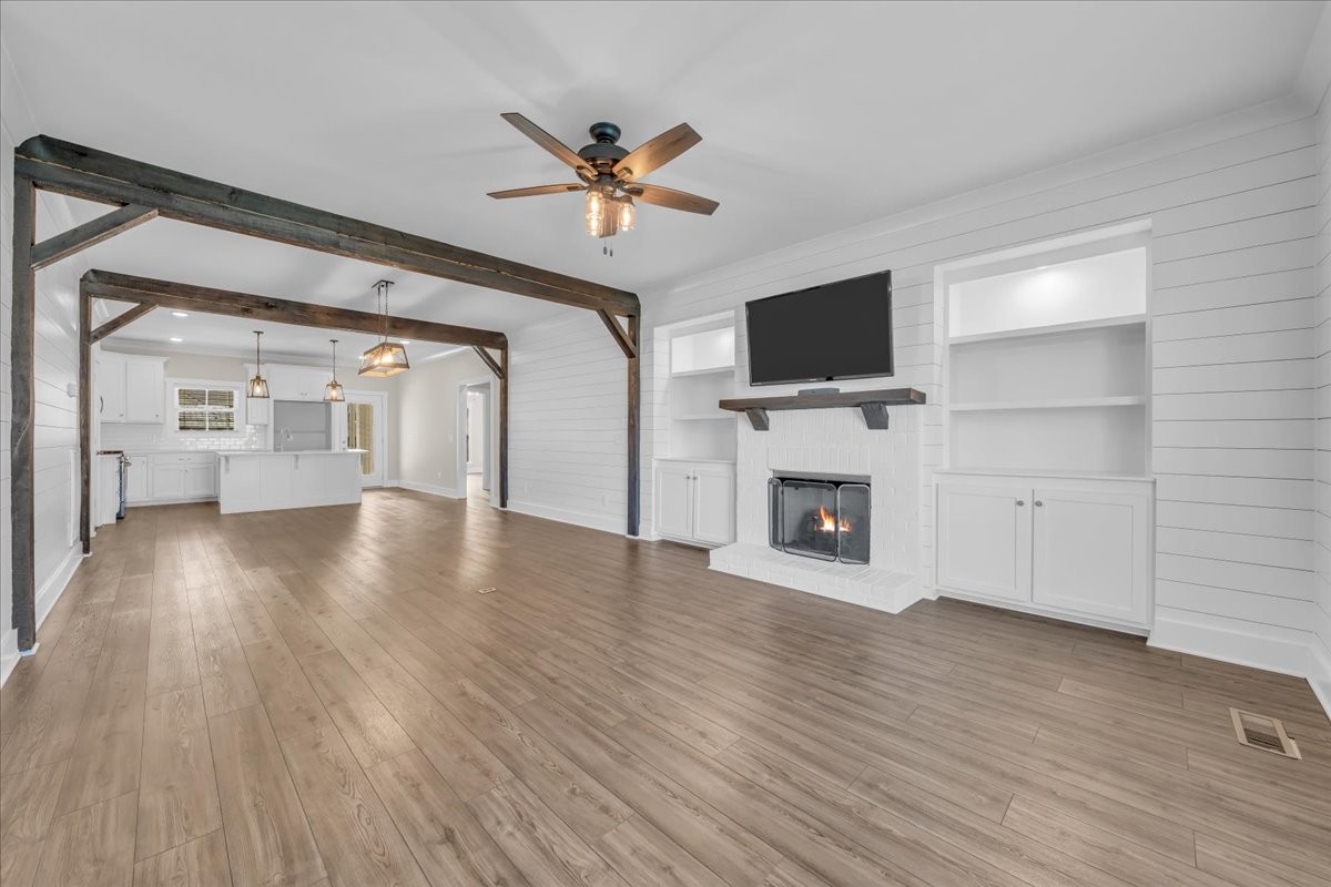 188 Bluegrass Drive Manchester, TN 37355 - Photo 12 of 84 a view of a livingroom with wooden floor and a fireplace