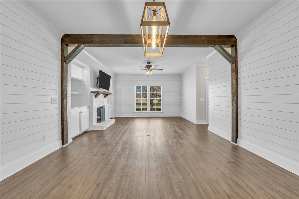 188 Bluegrass Drive Manchester, TN 37355 - Photo 17 of 84 a view of empty room with wooden floor and fireplace