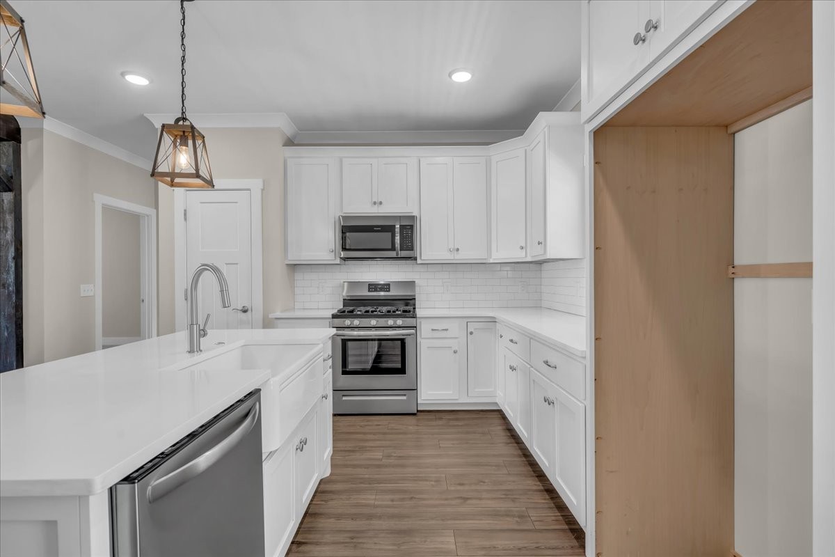 188 Bluegrass Drive Manchester, TN 37355 - Photo 25 of 84 a kitchen with white cabinets stainless steel appliances and sink