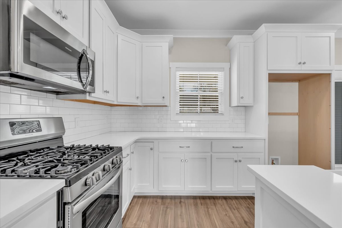 188 Bluegrass Drive Manchester, TN 37355 - Photo 29 of 84 a kitchen with granite countertop white cabinets and appliances