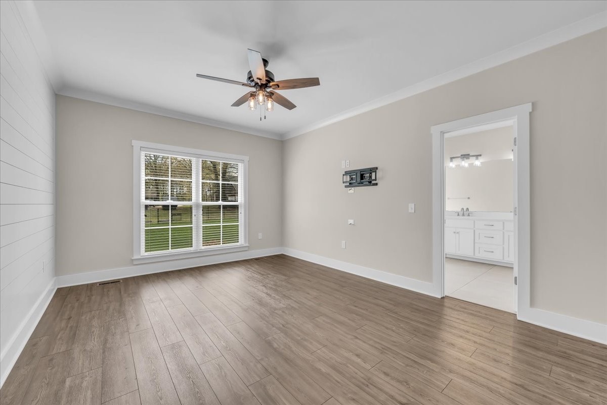 188 Bluegrass Drive Manchester, TN 37355 - Photo 30 of 84 a view of empty room with wooden floor and fan
