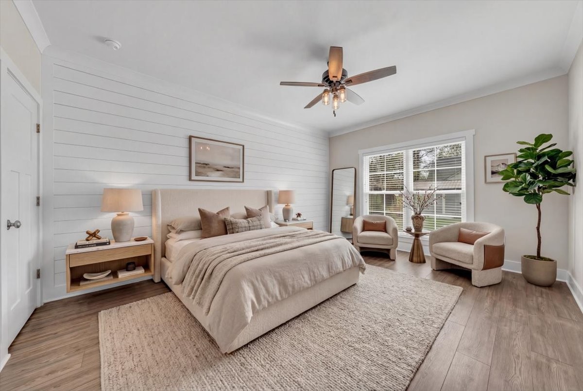 188 Bluegrass Drive Manchester, TN 37355 - Photo 33 of 84 a spacious bedroom with a bed a couch and potted plant