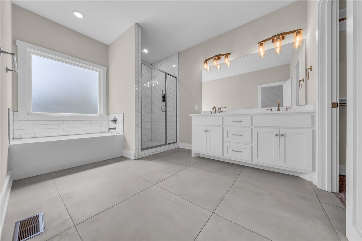 188 Bluegrass Drive Manchester, TN 37355 - Photo 34 of 84 a spacious bathroom with a mirror sink and bathtub