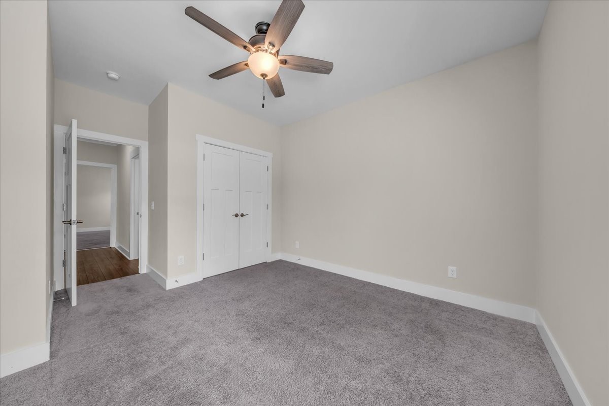 188 Bluegrass Drive Manchester, TN 37355 - Photo 46 of 84 an empty room with a ceiling fan and a window