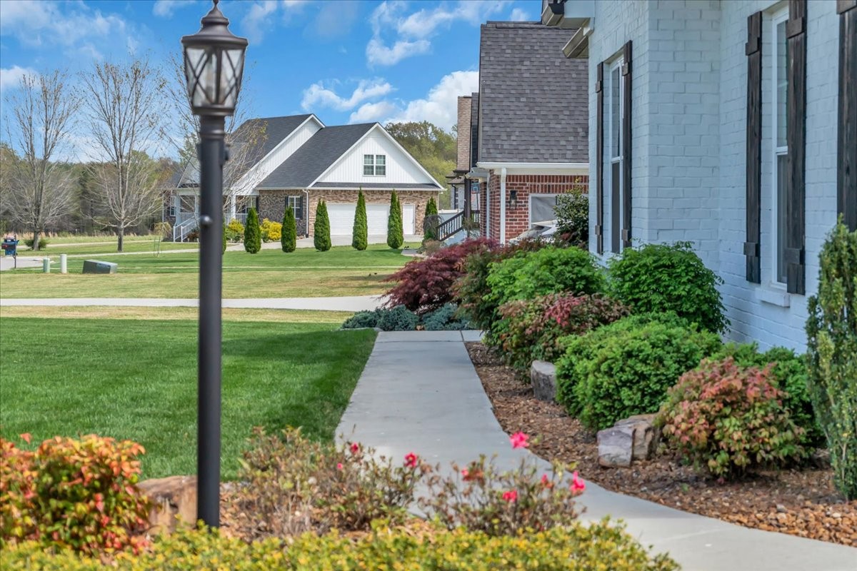 188 Bluegrass Drive Manchester, TN 37355 - Photo 6 of 84 a front view of a house with garden