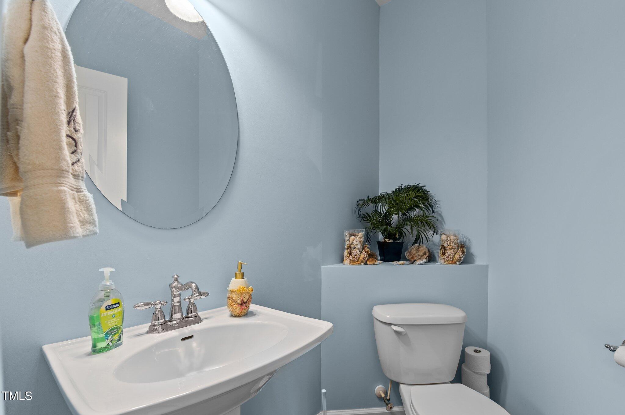 9016 New Century Road Wake Forest, NC 27587 - Photo 23 of 43 Additional half bath on main floor