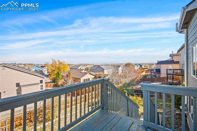 a view of a balcony with an outdoor seating