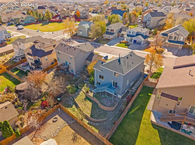 an aerial view of a house with swimming pool and ocean view