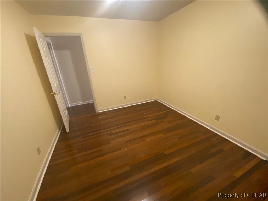 7944 Terrapin Cove Road Gloucester Point, VA 23062 - Photo 21 of 33 Empty room featuring dark hardwood / wood-style floors