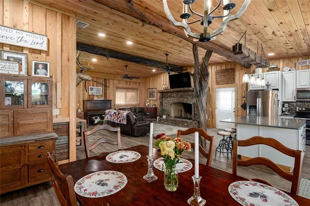 a bedroom with furniture and a flat screen tv