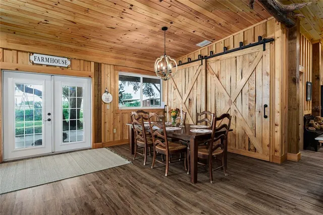 a bedroom with a bed and flat screen tv