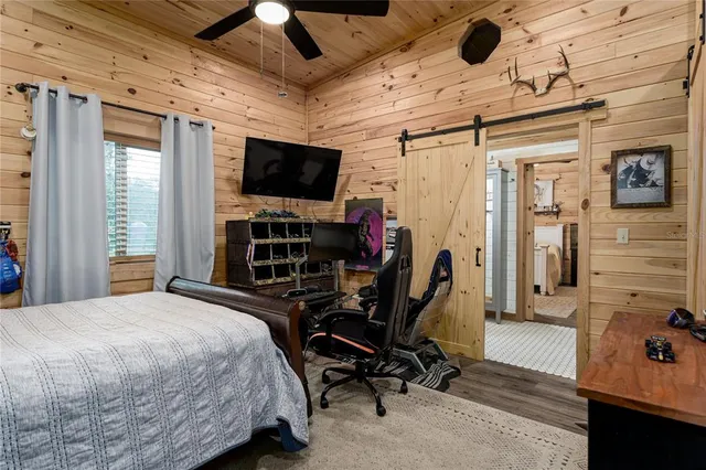 a view of swimming pool with a yard and trees