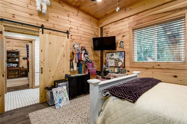 a kitchen with stainless steel appliances granite countertop a stove a refrigerator and a wooden cabinets