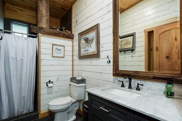 a view of a car is parked in front of a house
