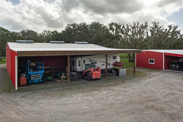 a view of a house with backyard porch and sitting area