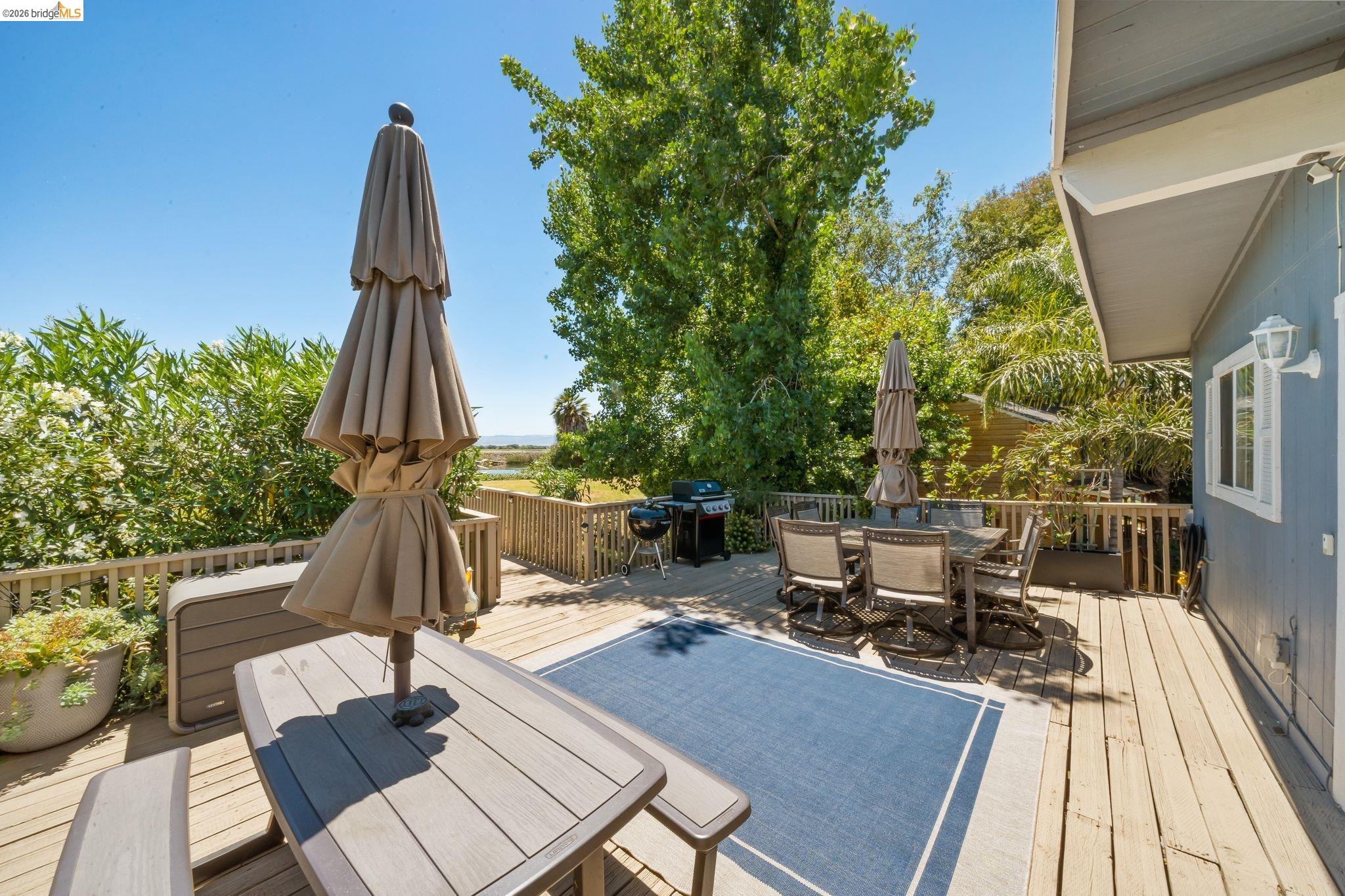 1704 Taylor Road Bethel Island, CA 94511 - Photo 44 of 73 Spacious outdoor deck featuring wood flooring, a perimeter railing, and exterior wall siding