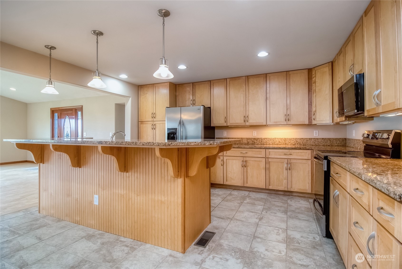 266 Thurber Road Touchet, WA 99360 - Photo 11 of 39 a kitchen with stainless steel appliances granite countertop a stove sink and cabinets