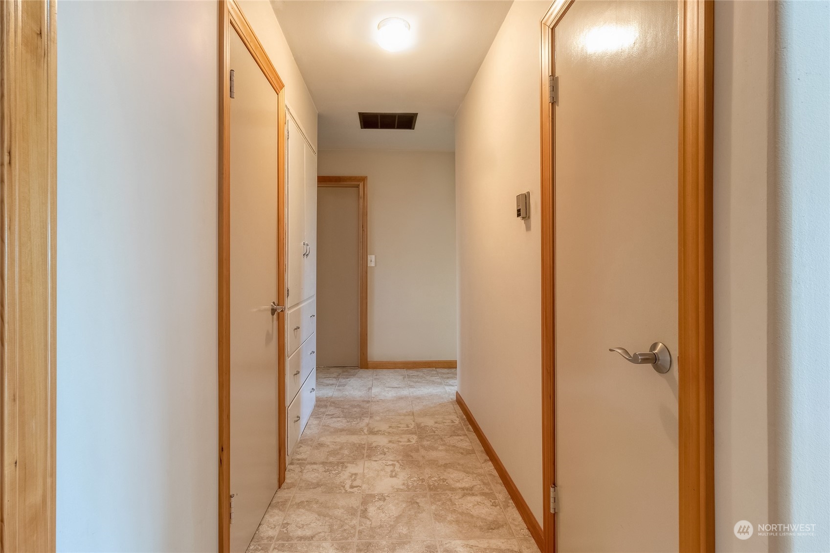 266 Thurber Road Touchet, WA 99360 - Photo 15 of 39 a view of a hallway with wooden shelves