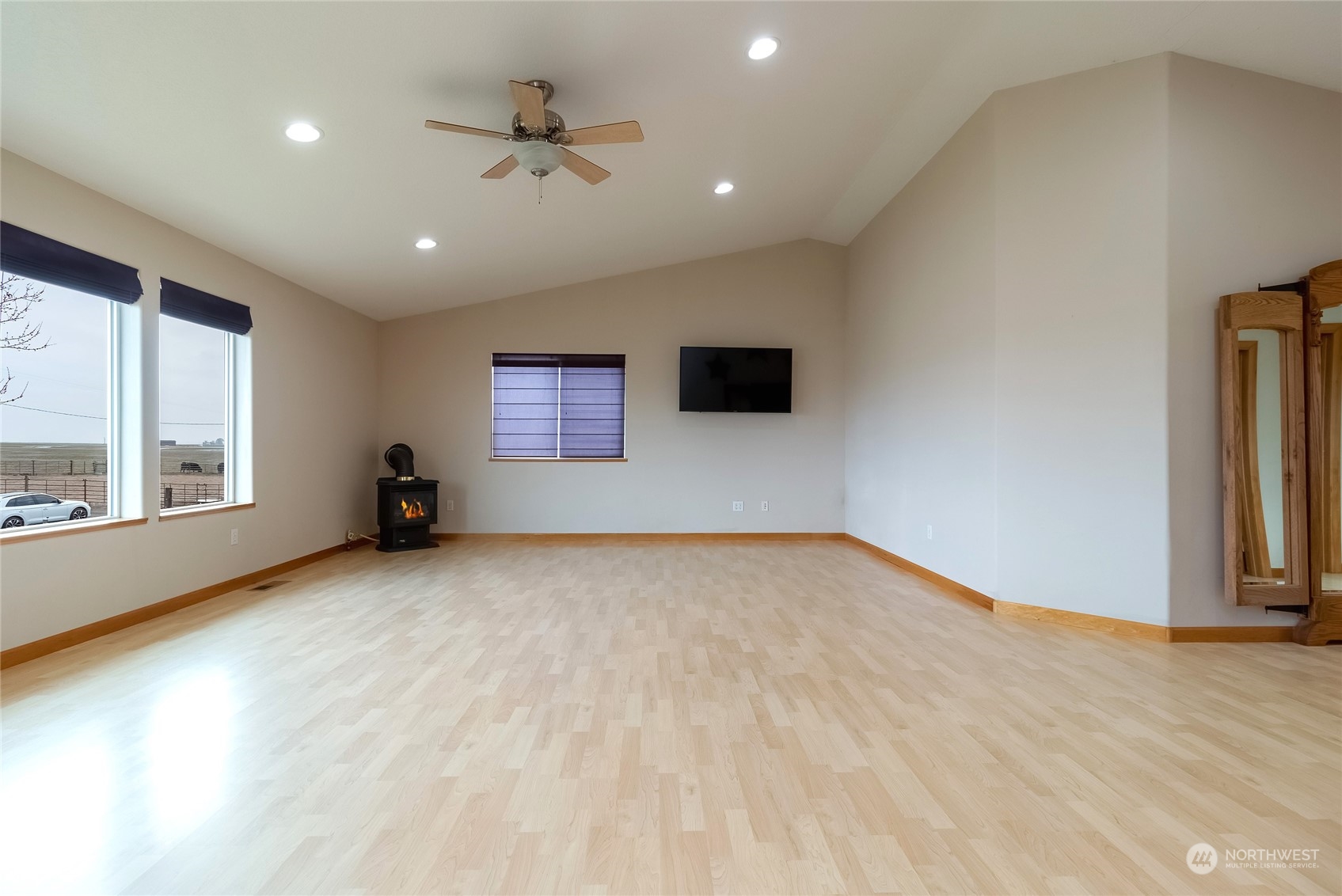 266 Thurber Road Touchet, WA 99360 - Photo 25 of 39 a view of an empty room with a window and a kitchen