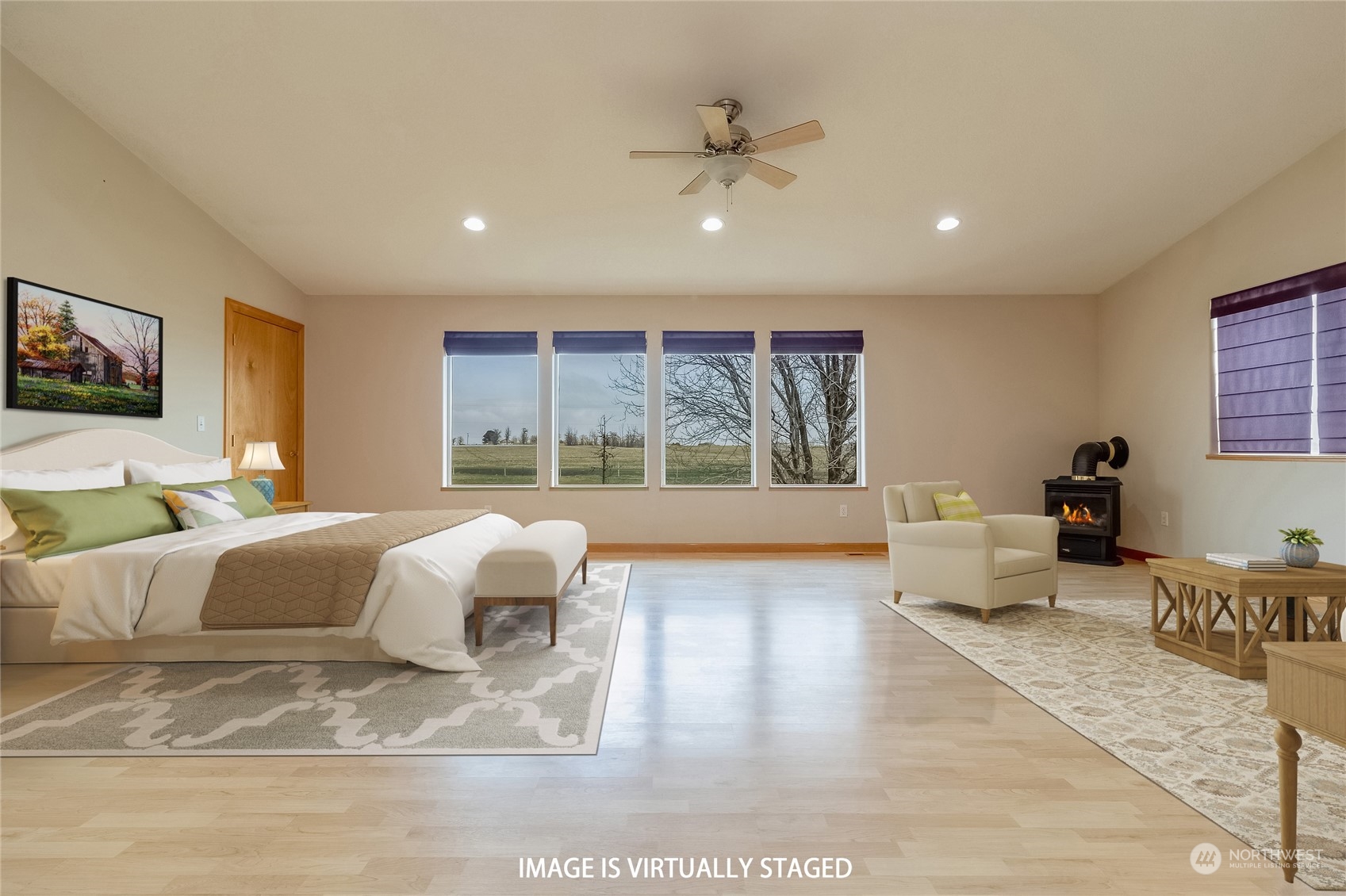 266 Thurber Road Touchet, WA 99360 - Photo 26 of 39 a spacious bedroom with a bed a couch and large window