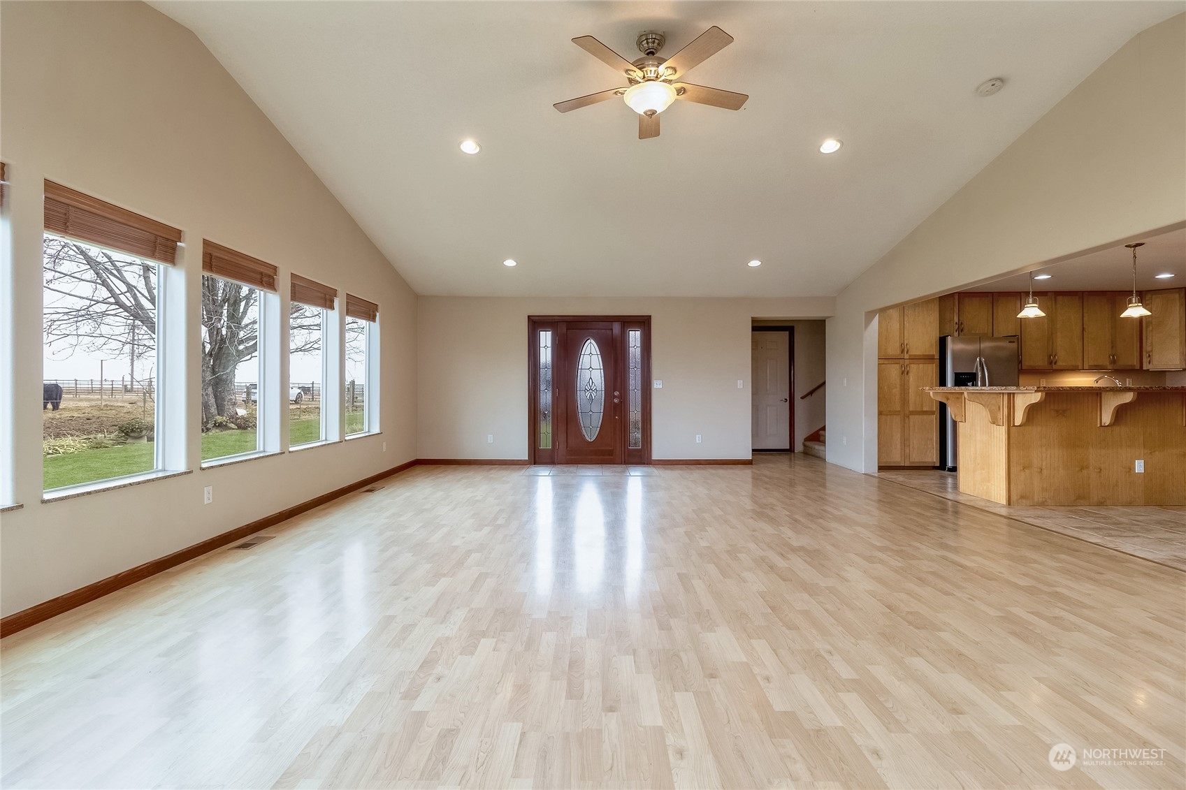 266 Thurber Road Touchet, WA 99360 - Photo 7 of 39 a view of an empty room with a window and wooden floor