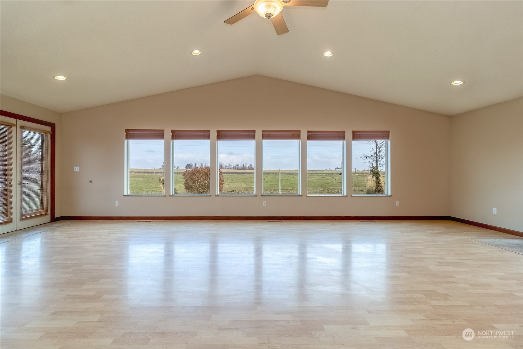 266 Thurber Road Touchet, WA 99360 - Photo 8 of 39 a view of a livingroom with wooden floor and window