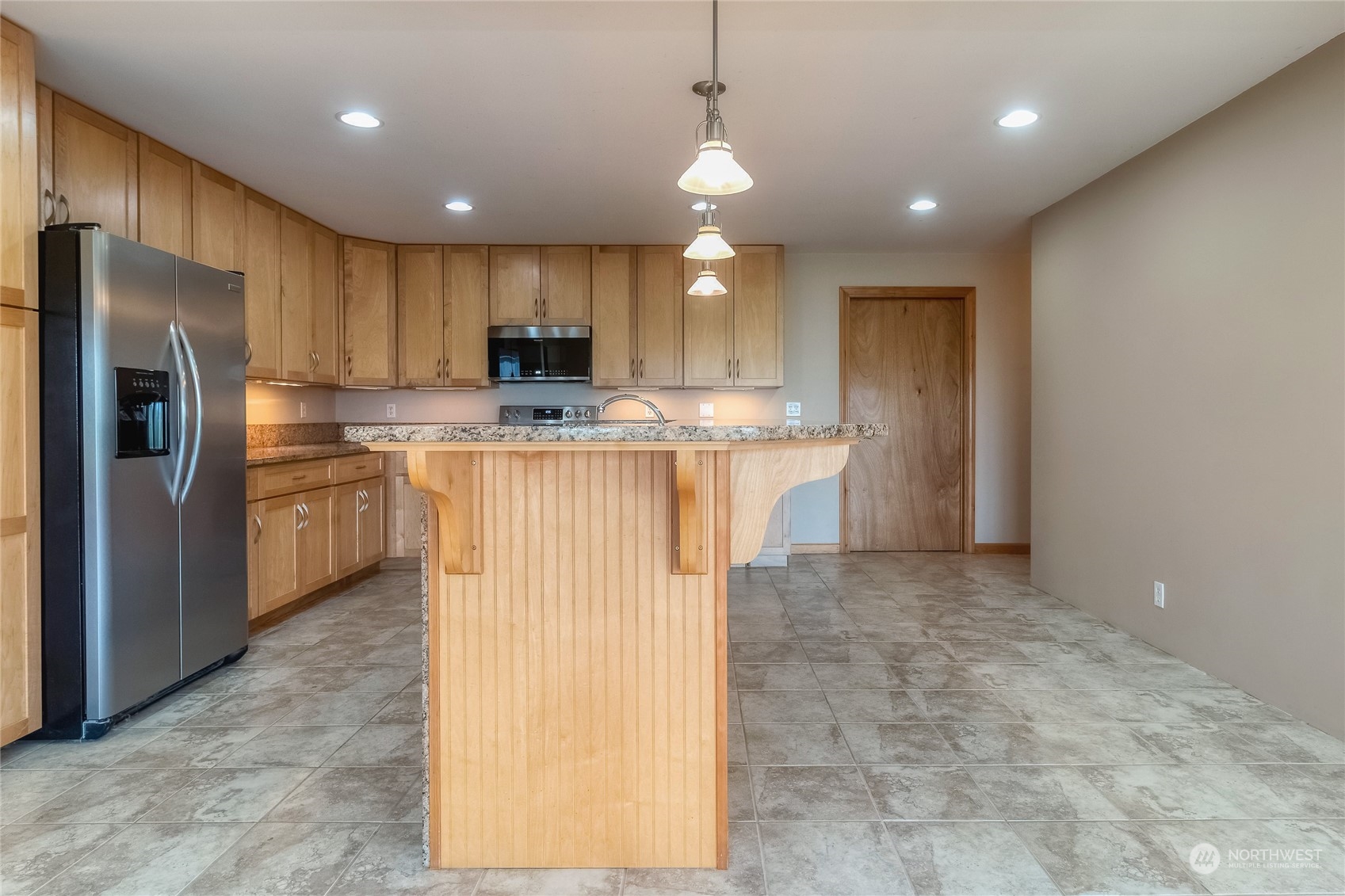266 Thurber Road Touchet, WA 99360 - Photo 9 of 39 a kitchen with kitchen island a sink appliances and cabinets