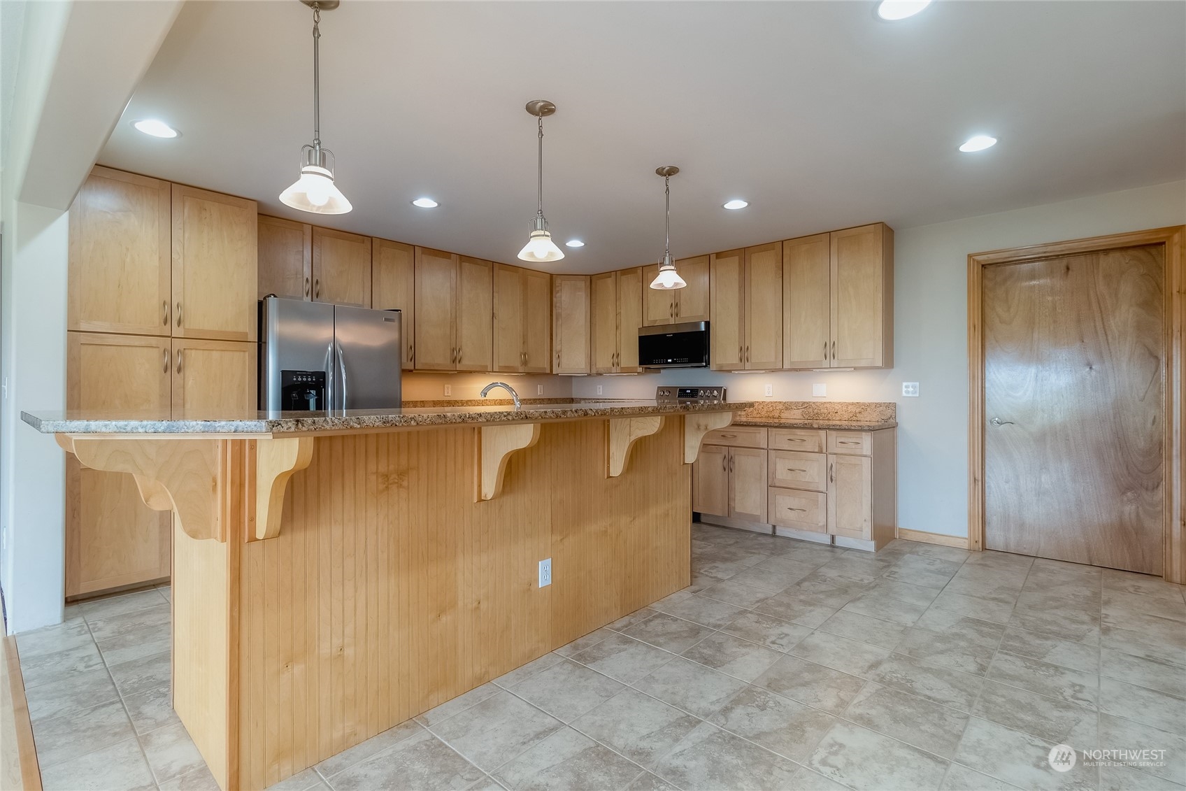 266 Thurber Road Touchet, WA 99360 - Photo 10 of 39 a kitchen with kitchen island a sink stainless steel appliances and cabinets
