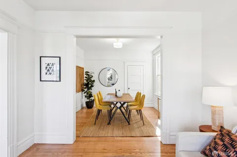 a view of a livingroom with furniture and a window