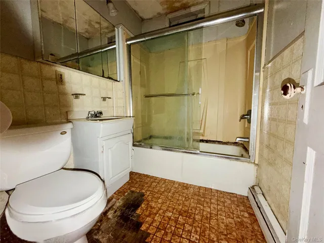 a bathroom with a toilet and shower