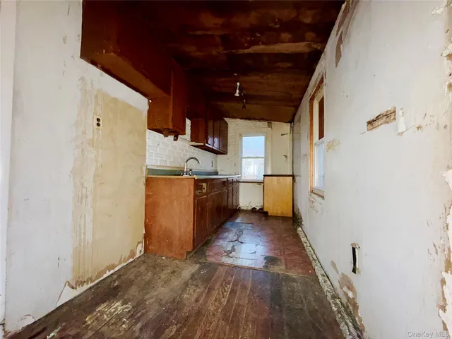 a view of a kitchen with wooden floor