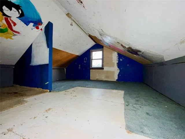 a view of an empty room with windows