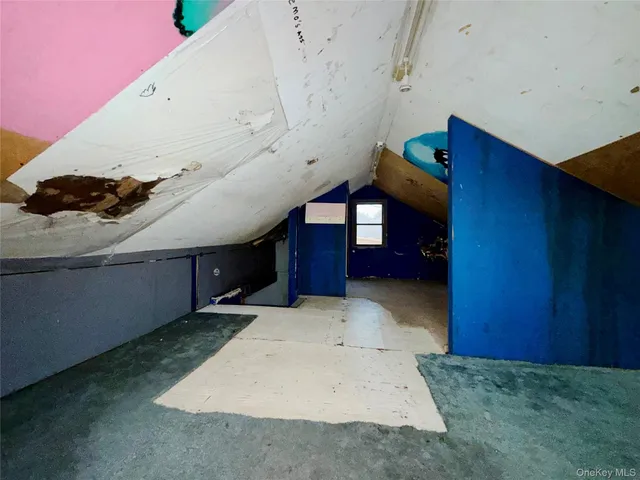 a view of a room with a large window