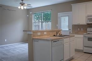 17606 Bering Bridge Lane Humble, TX 77346 - Photo 7 of 8 a kitchen with a sink and cabinets