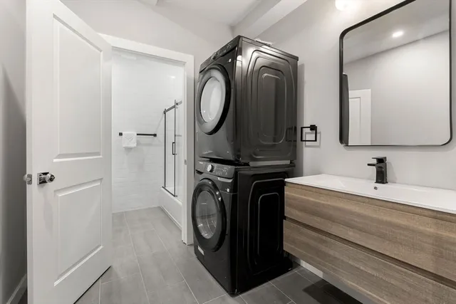 a bathroom with a sink a mirror and vanity