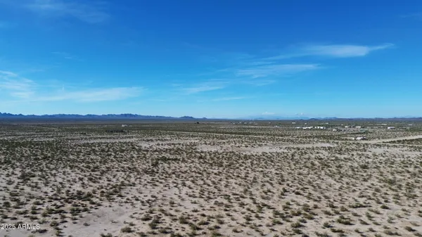 a view of a large body of water with a city view